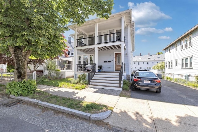 72 Rawson Rd Unit 2, Arlington, MA 02474 - view of front of property with a balcony, stairs, and a porch
