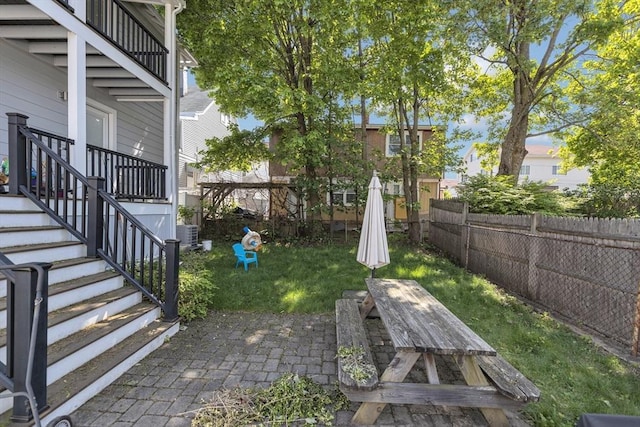 72 Rawson Rd Unit 2, Arlington, MA 02474 - view of yard featuring a patio area, central AC unit, and stairs