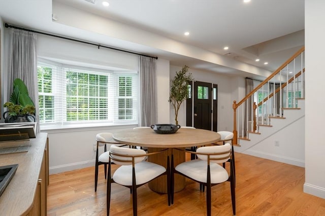 16 Border Rd, Reading, MA 01867 - dining space featuring light wood finished floors, healthy amount of natural light, stairway, and recessed lighting