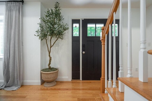 16 Border Rd, Reading, MA 01867 - entrance foyer with light wood-type flooring and baseboards