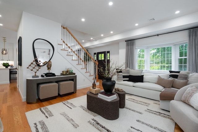 16 Border Rd, Reading, MA 01867 - living area featuring stairs, wood finished floors, and recessed lighting