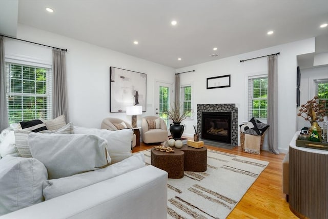 16 Border Rd, Reading, MA 01867 - living room with healthy amount of natural light, recessed lighting, light wood-style flooring, and a fireplace with flush hearth