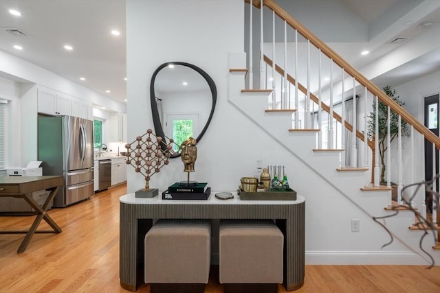 16 Border Rd, Reading, MA 01867 - stairway featuring wood finished floors and recessed lighting