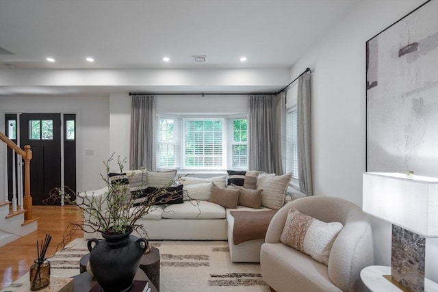 16 Border Rd, Reading, MA 01867 - living area featuring wood finished floors, stairway, and recessed lighting