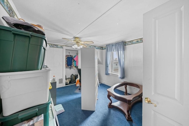 carpeted bedroom with visible vents and a ceiling fan