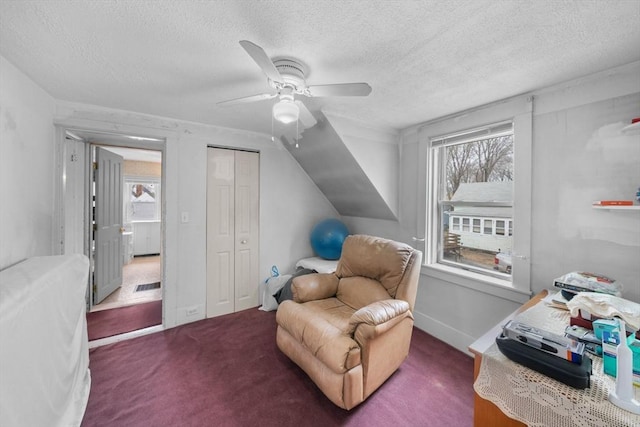 sitting room with carpet floors, visible vents, ceiling fan, a textured ceiling, and baseboards