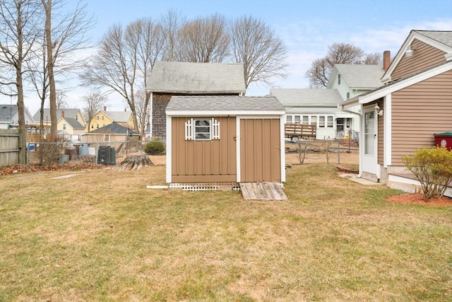 view of shed with fence