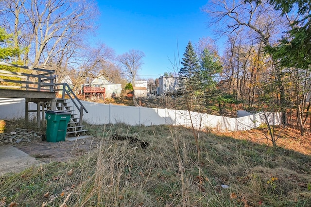 view of yard with a wooden deck