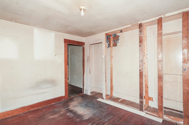 empty room featuring dark hardwood / wood-style flooring