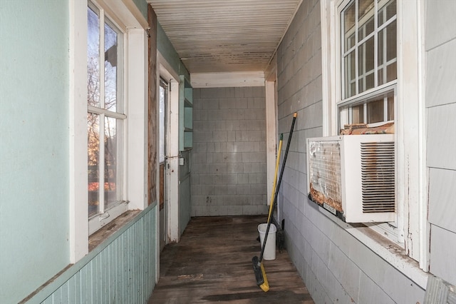 corridor with dark hardwood / wood-style floors and cooling unit