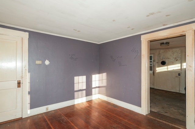 unfurnished room featuring crown molding and hardwood / wood-style floors