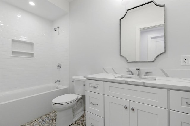 full bathroom featuring vanity, toilet, and tiled shower / bath