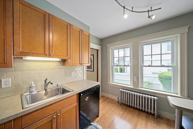 149 Milton Ave, Boston, MA 02124 - kitchen featuring radiator, dishwasher, a sink, baseboards, and light countertops