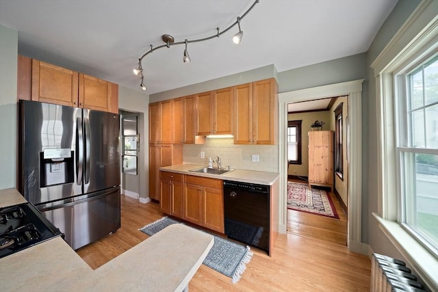 149 Milton Ave, Boston, MA 02124 - kitchen featuring dishwasher, a sink, radiator heating unit, stainless steel fridge with ice dispenser, and light countertops