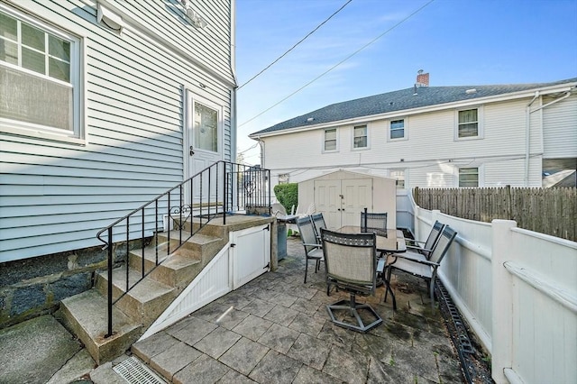 149 Milton Ave, Boston, MA 02124 - fenced backyard featuring outdoor dining space and a patio area