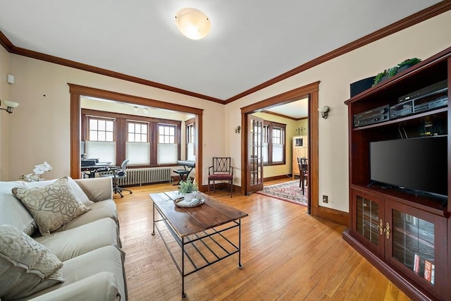 149 Milton Ave, Boston, MA 02124 - living area with radiator heating unit, light wood finished floors, baseboards, ornamental molding, and an office area