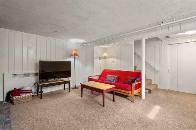 carpeted living room with stairway