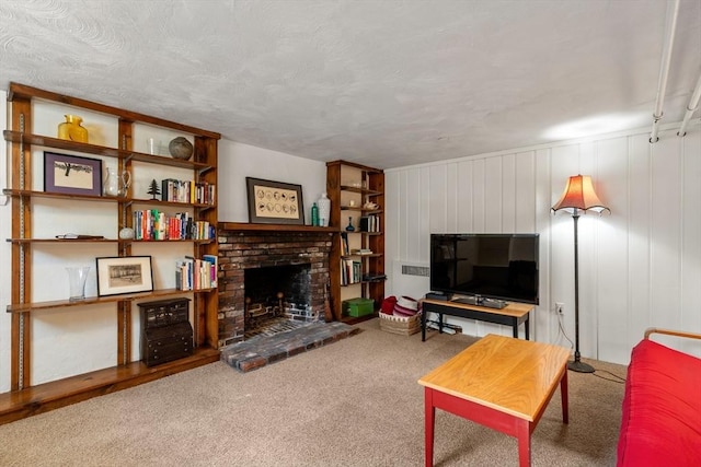 living area with a fireplace and carpet flooring