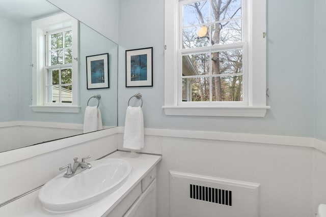 bathroom featuring vanity and radiator