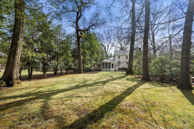 view of yard with a sunroom