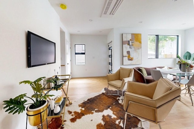 133 Charles St Unit 133, Cambridge, MA 02141 - living room featuring plenty of natural light and wood finished floors