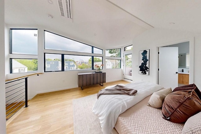 133 Charles St Unit 133, Cambridge, MA 02141 - bedroom featuring vaulted ceiling, light wood-style floors, and baseboards