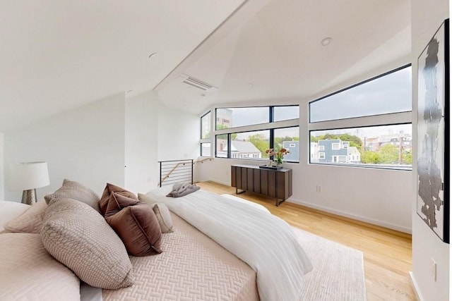 133 Charles St Unit 133, Cambridge, MA 02141 - bedroom with wood finished floors, lofted ceiling, and baseboards