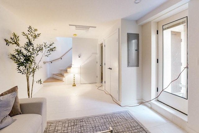 133 Charles St Unit 133, Cambridge, MA 02141 - hallway with electric panel, stairs, and baseboards