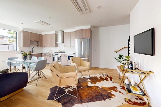 133 Charles St Unit 133, Cambridge, MA 02141 - living area featuring light wood-style floors and baseboards