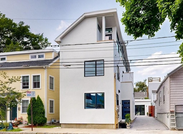 133 Charles St Unit 133, Cambridge, MA 02141 - view of front of property with stucco siding