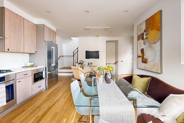 133 Charles St Unit 133, Cambridge, MA 02141 - dining room featuring light wood-style flooring, stairs, and recessed lighting