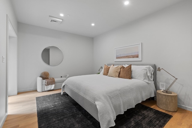 bedroom with light hardwood / wood-style flooring