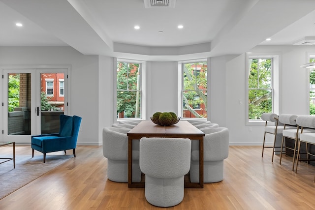 dining space with light hardwood / wood-style flooring and a wealth of natural light