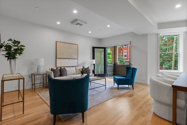 living room featuring light hardwood / wood-style flooring and plenty of natural light