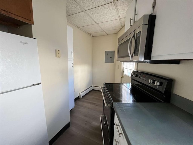 kitchen featuring a drop ceiling, white fridge, electric panel, black range with electric stovetop, and dark hardwood / wood-style floors