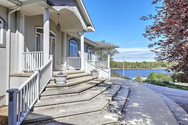 2386 Pleasant, Dighton, MA 02715 - entrance to property with covered porch, a water view, and stucco siding