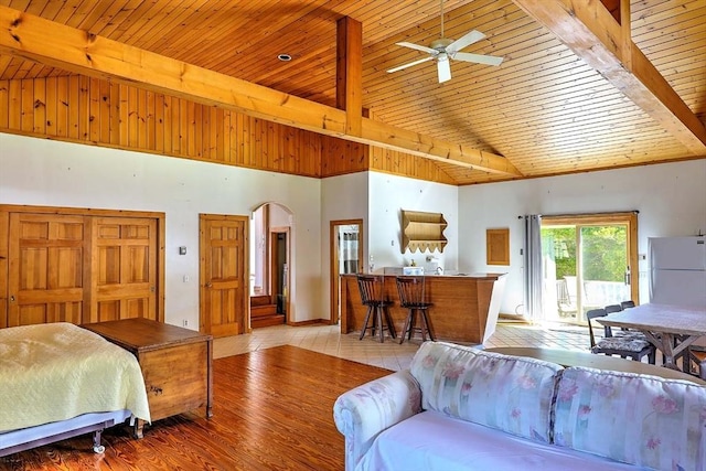 2386 Pleasant, Dighton, MA 02715 - bedroom with wood ceiling with exposed beams, freestanding refrigerator, arched walkways, access to exterior, and wood finished floors
