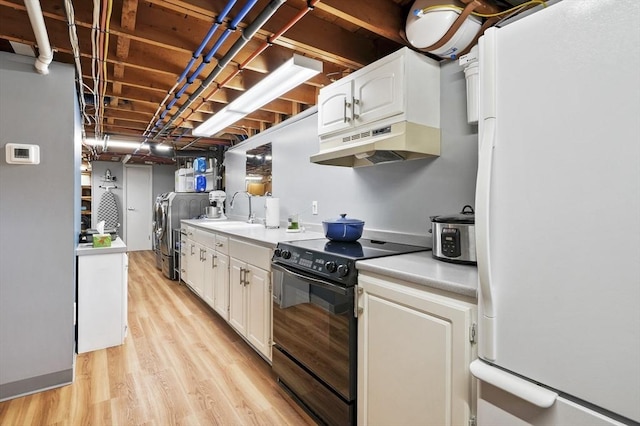 4 Polito Dr, Worcester, MA 01604 - kitchen featuring freestanding refrigerator, black electric range, under cabinet range hood, separate washer and dryer, and a sink