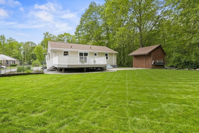 4 Polito Dr, Worcester, MA 01604 - rear view of property featuring a wooden deck, a lawn, and an outbuilding