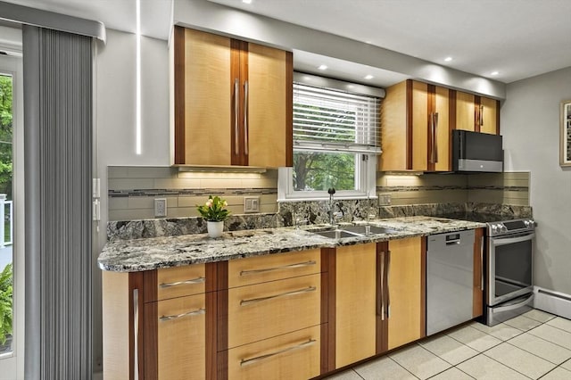 4 Polito Dr, Worcester, MA 01604 - kitchen with a sink, appliances with stainless steel finishes, light tile patterned floors, stone counters, and brown cabinets