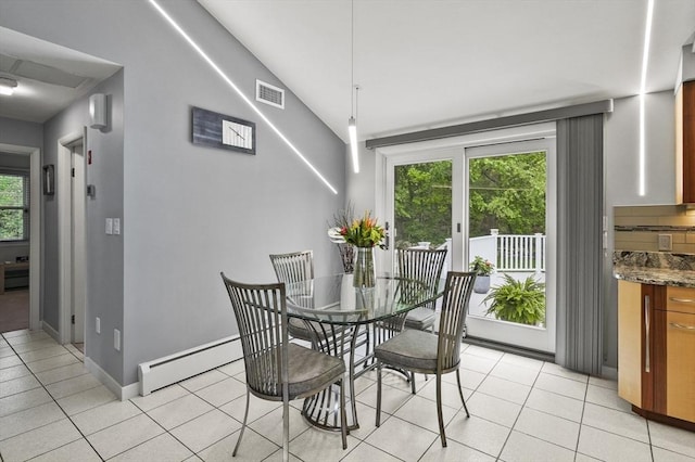 4 Polito Dr, Worcester, MA 01604 - dining area with light tile patterned floors, a baseboard heating unit, baseboards, and vaulted ceiling
