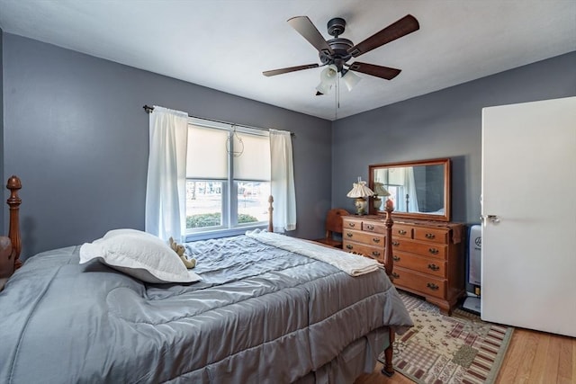 bedroom featuring ceiling fan and light hardwood / wood-style floors