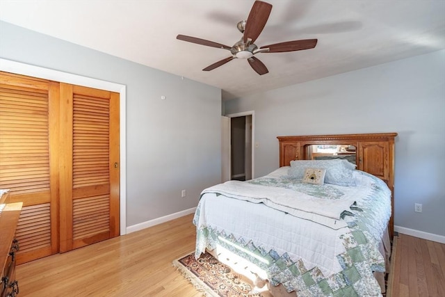 bedroom featuring ceiling fan, light hardwood / wood-style floors, and a closet