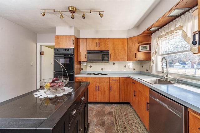 kitchen with tasteful backsplash, sink, and black appliances