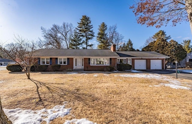 ranch-style house featuring a garage