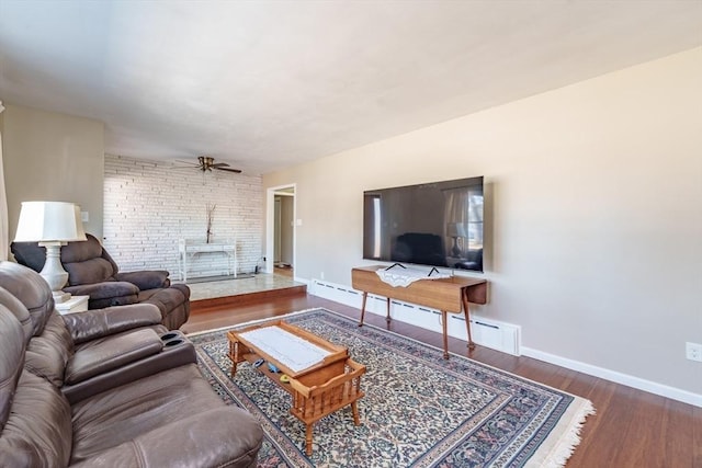 living room featuring ceiling fan and dark hardwood / wood-style flooring