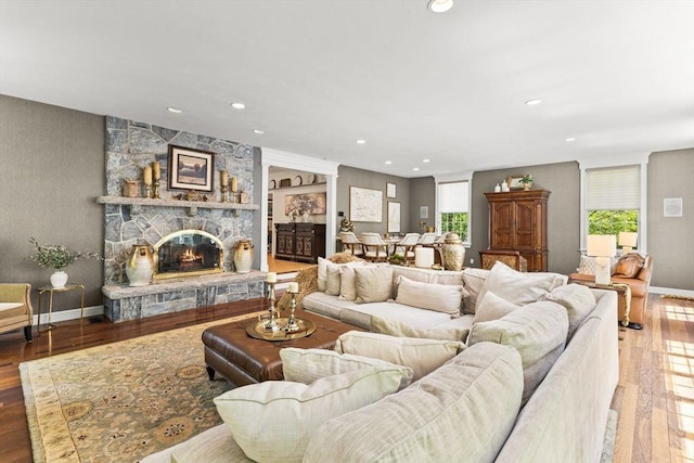 8 Riverside Ter, Easton, MA 02356 - living room featuring wood finished floors, a stone fireplace, recessed lighting, and baseboards