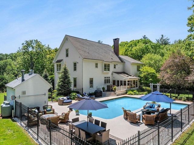 8 Riverside Ter, Easton, MA 02356 - back of house with an outdoor hangout area, a chimney, and a patio area