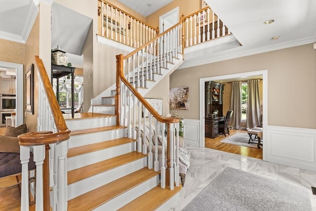 8 Riverside Ter, Easton, MA 02356 - staircase featuring crown molding, wainscoting, and a decorative wall
