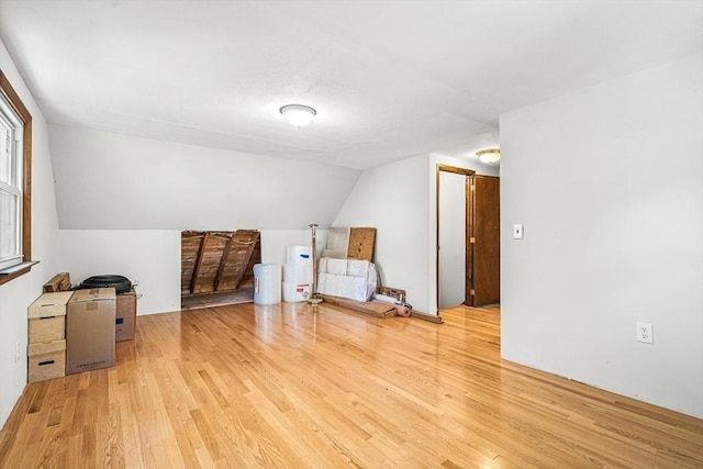 98 G St, Dracut, MA 01826 - bonus room featuring light wood finished floors, vaulted ceiling, and tankless water heater